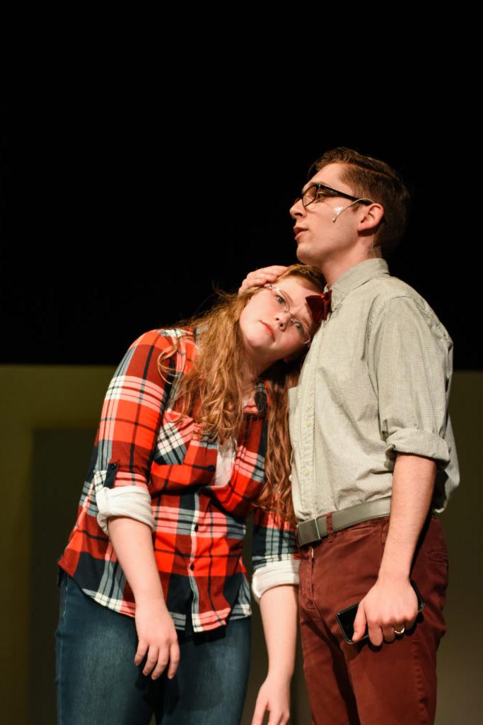 6525 -- From left, Bryce, played by Nathan Puckett, comforts Jenni Jensen, played by Diandra Cahall, who is experiencing trouble with her cell phone service. (Campbellsville University Photo by Ariel C. Emberton)