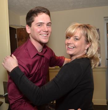 Leighton Lavey, a sophomore from Mayfield, Ky., gets a hug from Karla Adams, who has attended  Calvary Baptist Church since she was 18 months old, following Lavey's sermon at the church. (Campbellsville  University Photo by Joan C. McKinney)