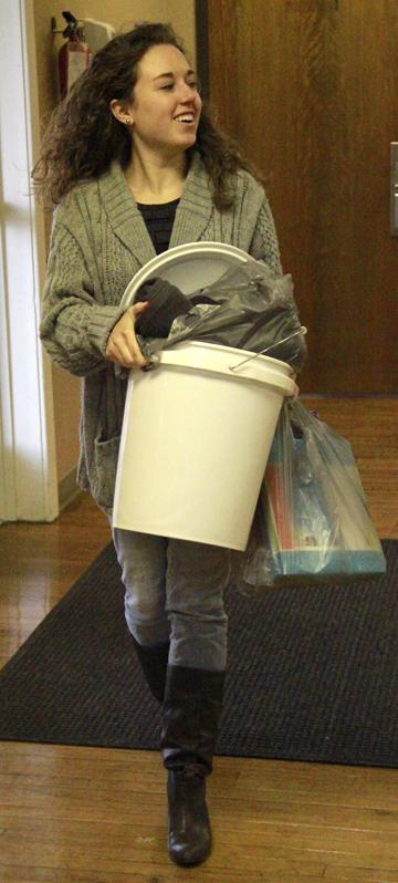 Victoria Hundley delivers her bucket at the Student  Activities Center. (Campbellsville University Photo by Rachel DeCoursey)