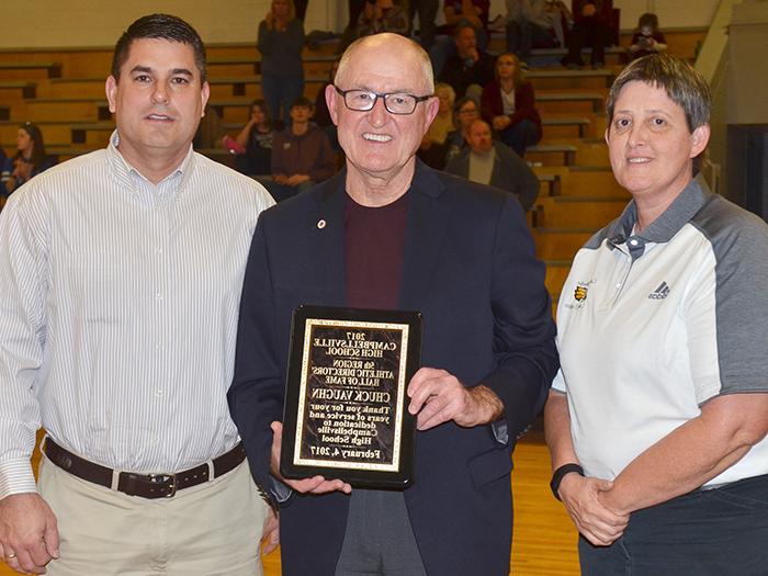 Chuck Vaughn, former Campbellsville Independent Schools superintendent, was inducted into the 5th Region Athletic Director’s Hall of Fame on Saturday, Feb. 4. He was honored during the CHS boys’ basketball game versus Metcalfe County. From left are CHS Assistant Athletic Director Katie Wilkerson, Vaughn and CHS Principal Kirby Smith. (CHS photo by Calen McKinney)